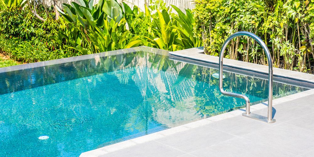 Beautiful landscape outdoor swimming pool in hotel and resort for leisure vacation and travel